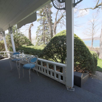 Front veranda overlooking Lake Geneva with swing